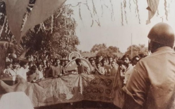 Senior SP Abdul Gafoor giving orders to attack the Maubima Surakeemay May Day procession and after the police opened fire.