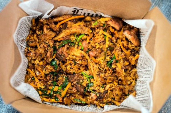 The chicken kottu has a pleasing tug of bitterness, from Sri Lankan curry powder roasted until it’s as dark as coffee.